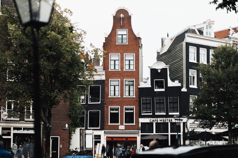 Scenic view of iconic Amsterdam architecture in a vibrant urban setting.