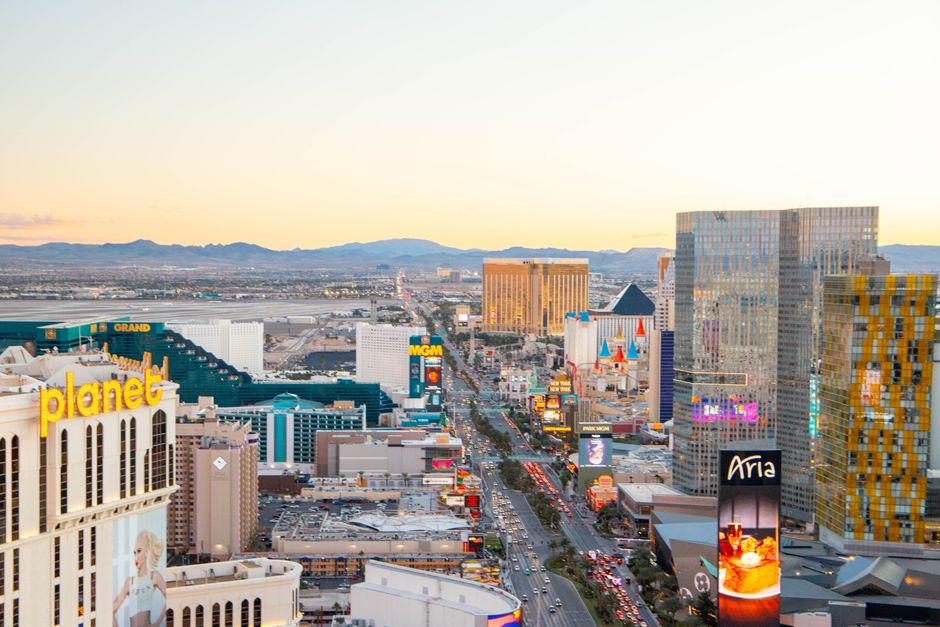 Captivating aerial view of the Las Vegas Strip skyline at sunset, featuring iconic hotels and casinos.