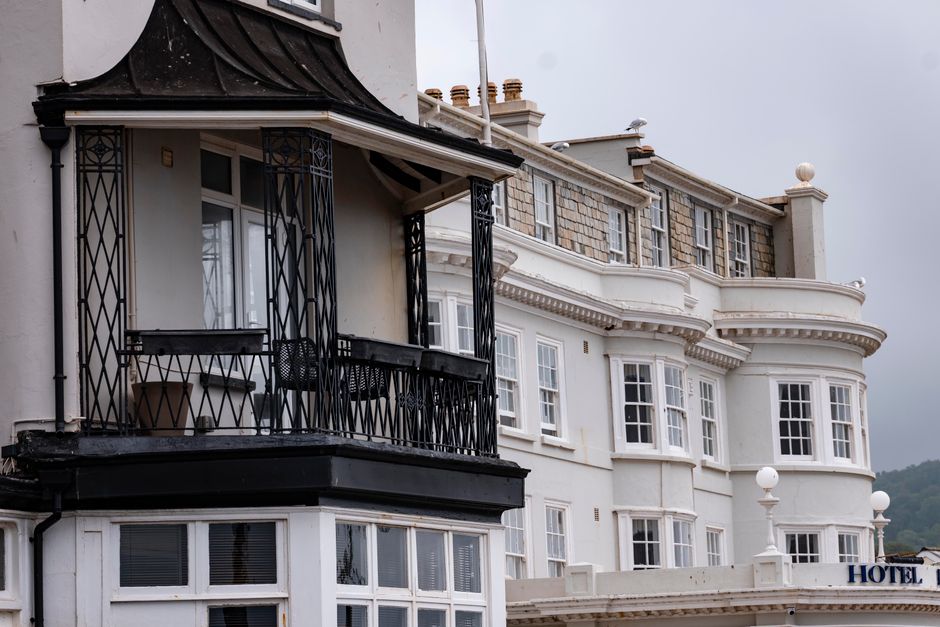 Close-up of Victorian-style buildings in Weymouth, showcasing intricate ironwork and classic design.